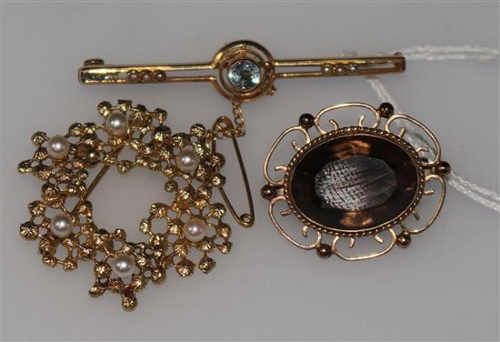 A 15ct gold and gem set bar brooch and two 9ct brooches.